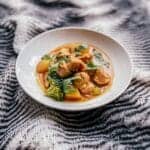 white bowl of chicken and vegetable thai curry