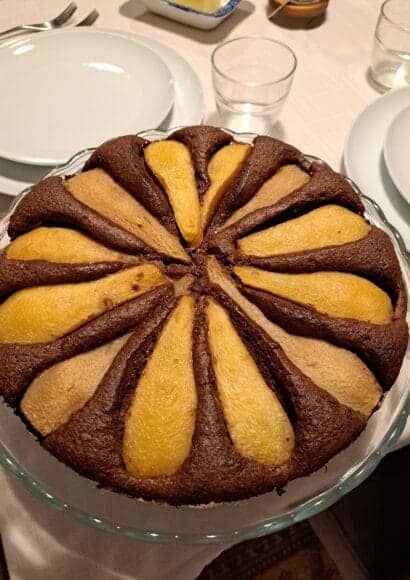 chocolate pear cake on a cake stand