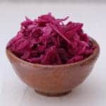 earthenware bowl filled with vibrant red picked cabbage