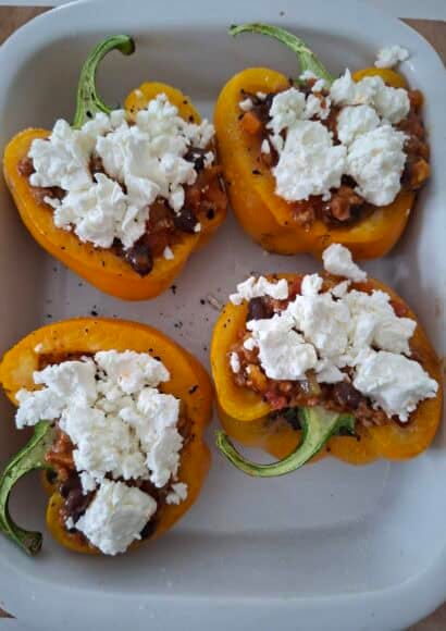4 halves of yellow peppers, stuffed with turkey and black bean chilli, topped with crumbled feta